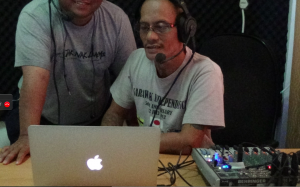RFS DJ Peter John Jaban works with a colleague on the show