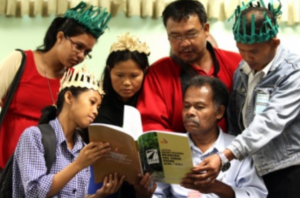 Orang Asli representatives read the report on the national inquiry into the land rights of indigenous peoples by SUHAKAM.