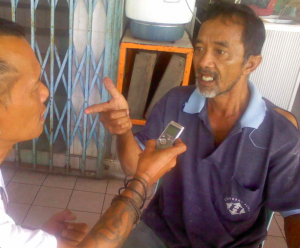 Peter John Jaban interviews a local headman