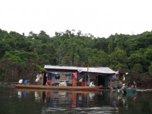 Helping the poor?  The natives of Bakun who have resorted back to living in their flooding homes, now floating on the lake.