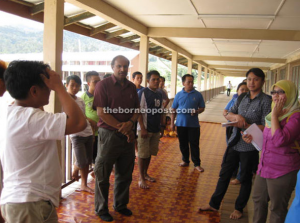 Human Rights commissioner James Nayagam listens to the plight of the Penan in Murum.