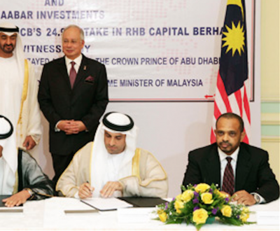 By contrast, Khadem al-Quubaisi signs a cooperation agreement with 1MDB in 2013 under the eye of the PM