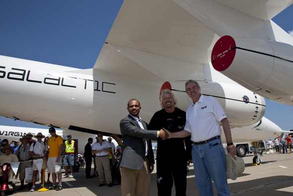 Richard Branson signs a major investment agreement partnership with Mohamed Badawy Al-Hussseiny, CEO of Aabar Investments of Abu Dhabi. July 28, 2009.