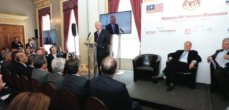 Najib opens the Trade Conference in Malborough House, London in the middle of the 1MDB scandal. Marland (right) described the event as a 'huge love-in' to the audience 