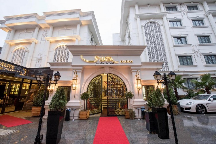 Grand hotel with red carpet welcome