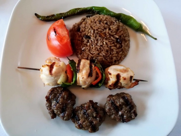 Numerous close ups of people's food plates, indicate one of the interests of the trip